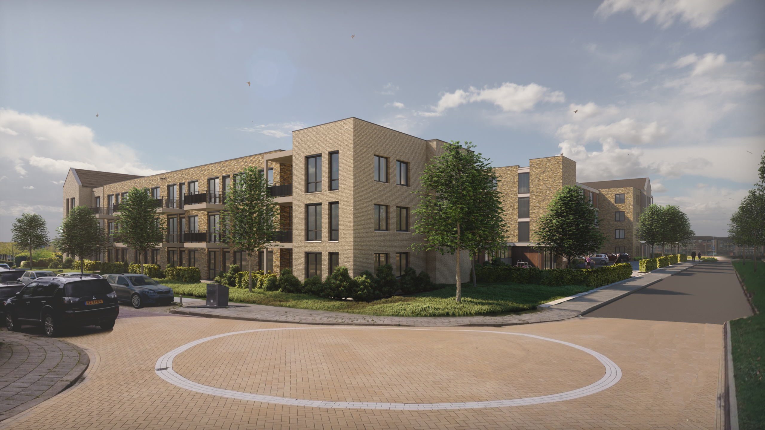 Afbeelding van een modern appartementencomplex met bakstenen gevels, omgeven door bomen en een rustige straat op de voorgrond.