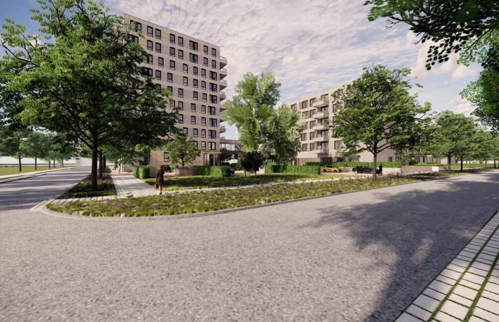 Afbeelding van een modern appartementencomplex omgeven door groen, met bomen en een open binnenplaats onder een bewolkte hemel.