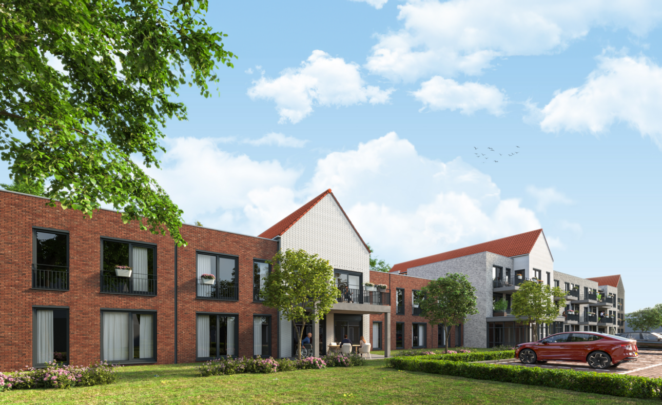 Een moderne woonwijk met bakstenen gebouwen, groene bomen en een geparkeerde rode auto onder een blauwe lucht met wolken.